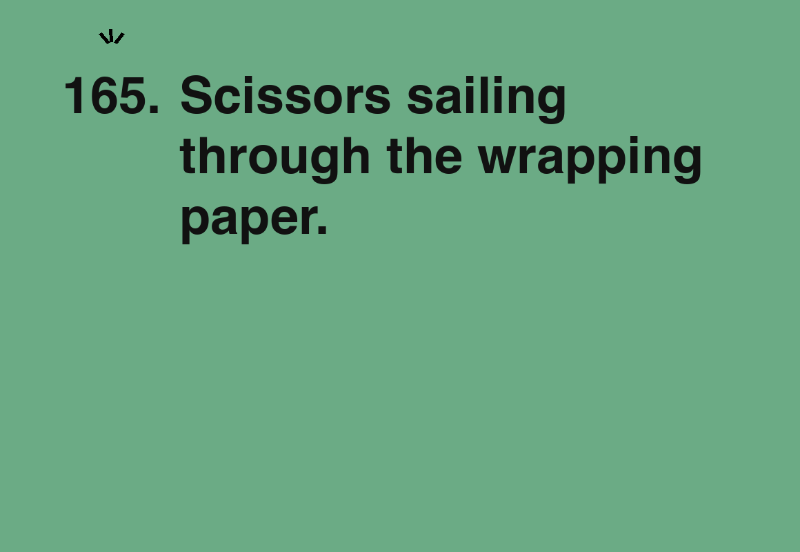 Scissors sailing through the wrapping paper. — card 165 of the 1000 little things list