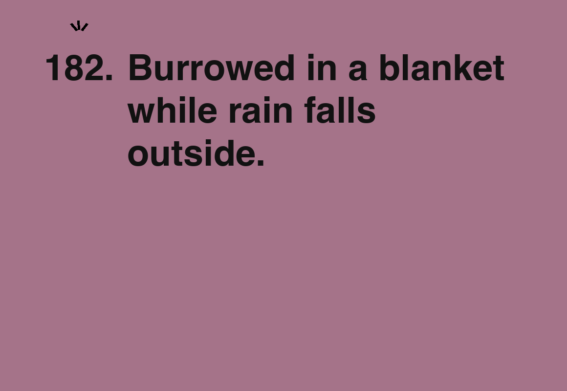 Burrowed in a blanket while rain falls outside. — card 182 of the 1000 little things list