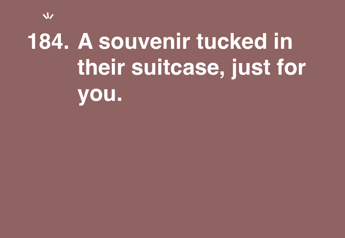 A souvenir tucked in their suitcase, just for you. — card 184 of the 1000 little things list