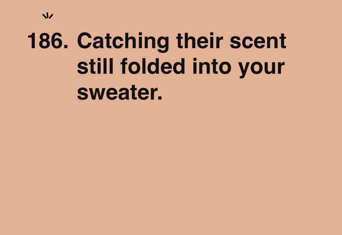 Catching their scent still folded into your sweater. — card 186 of the 1000 little things list