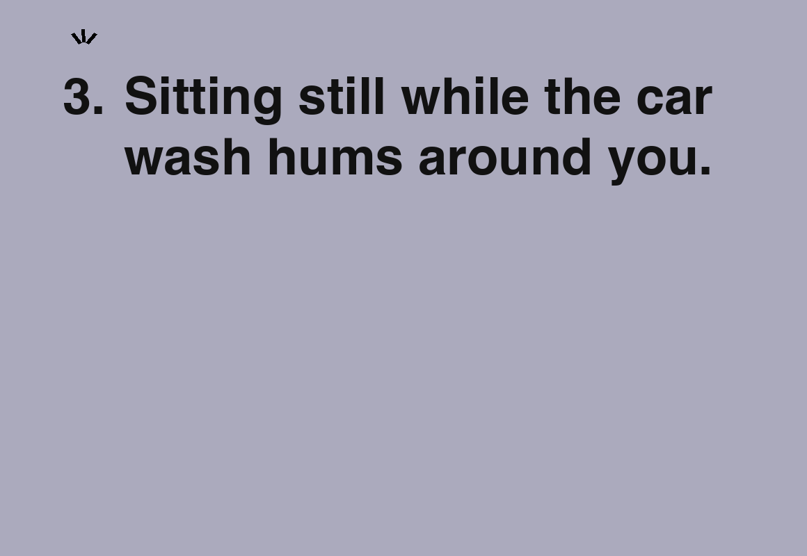 Sitting still while the car wash hums around you. — card 3 of the 1000 little things list