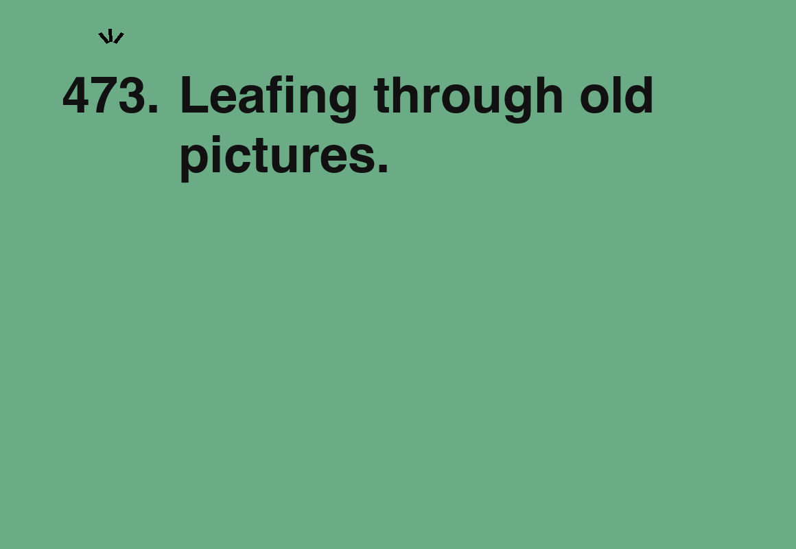 Leafing through old pictures. — card 473 of the 1000 little things list