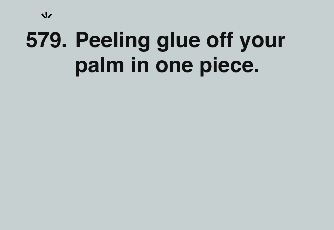Peeling glue off your palm in one piece. — card 579 of the 1000 little things list