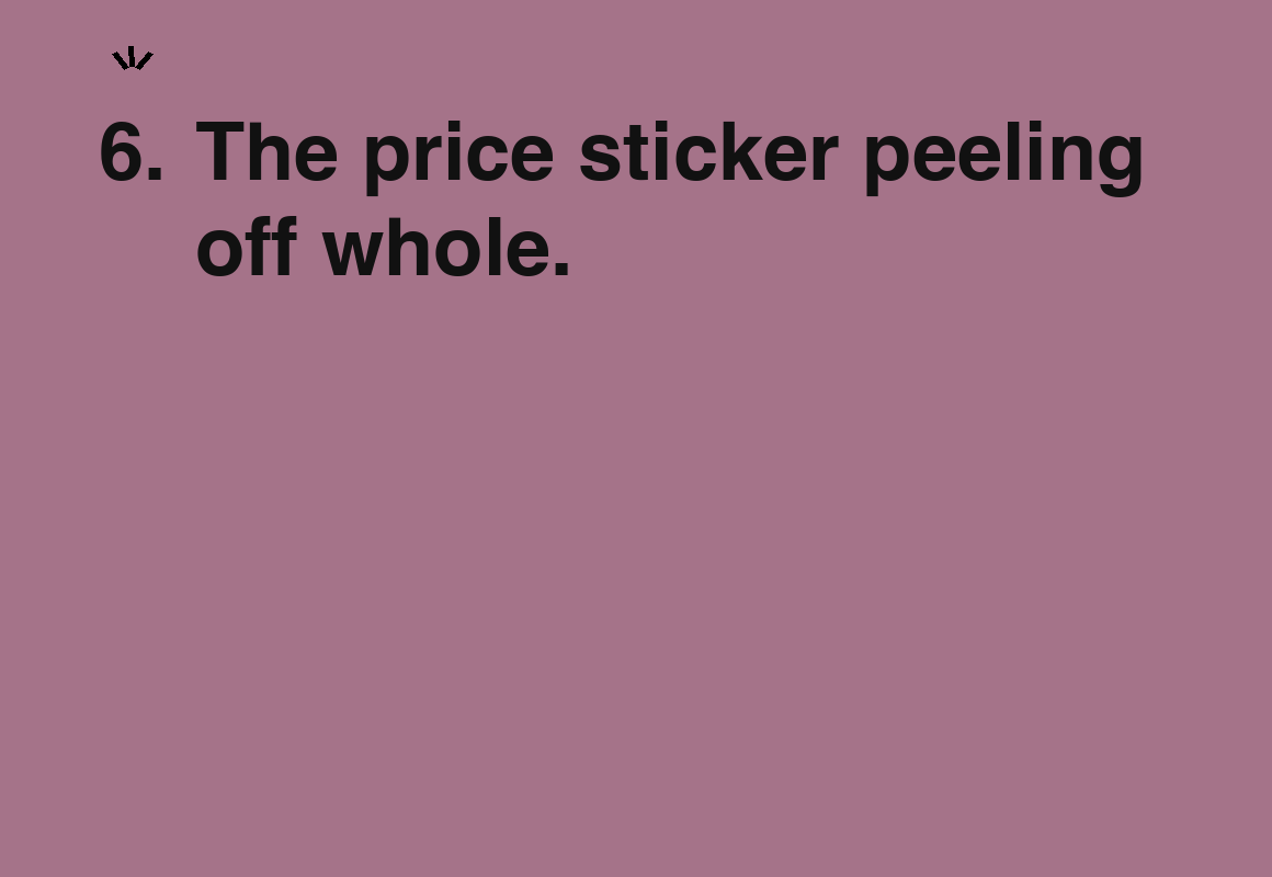The price sticker peeling off whole. — card 6 of the 1000 little things list