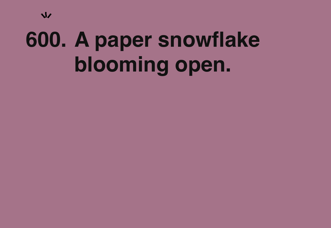 A paper snowflake blooming open. — card 600 of the 1000 little things list