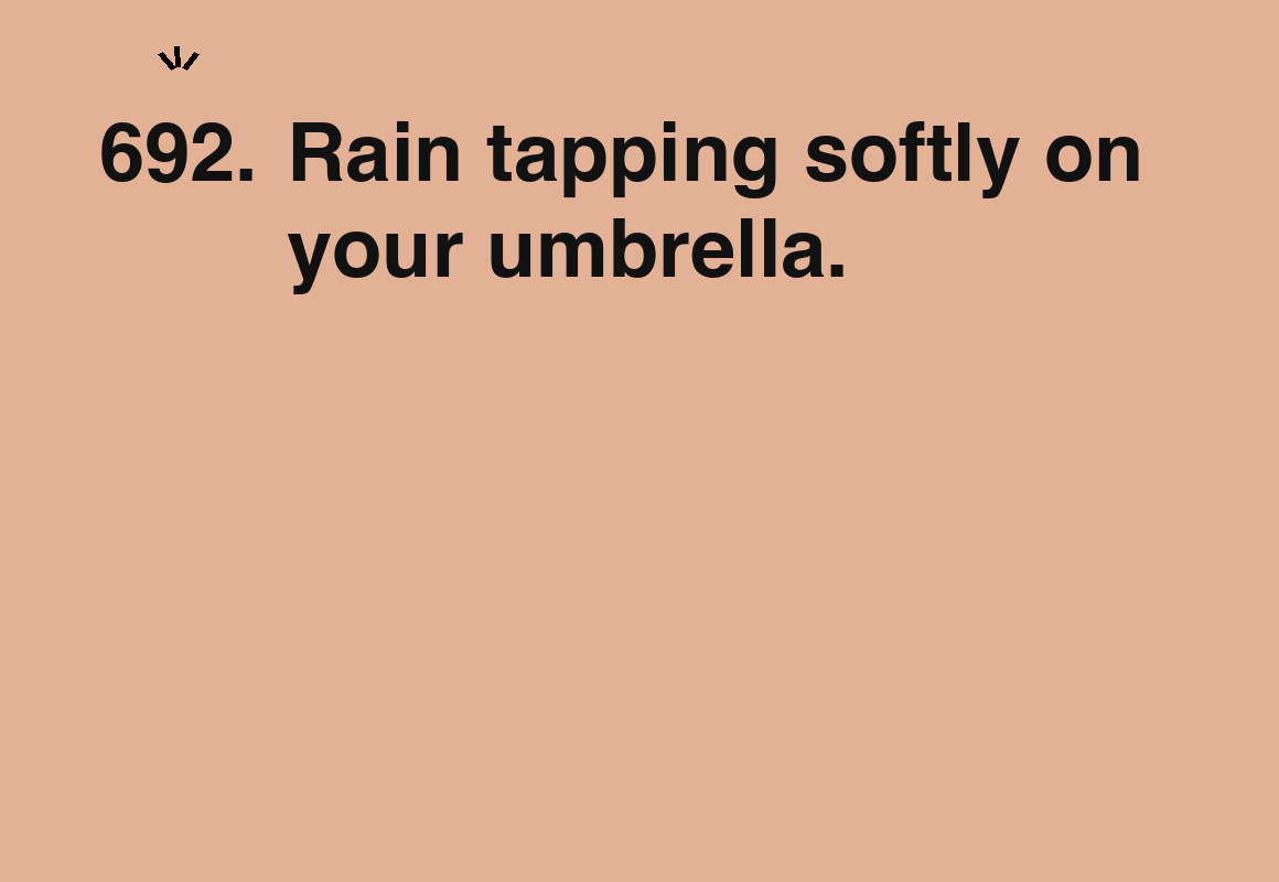 Rain tapping softly on your umbrella. — card 692 of the 1000 little things list