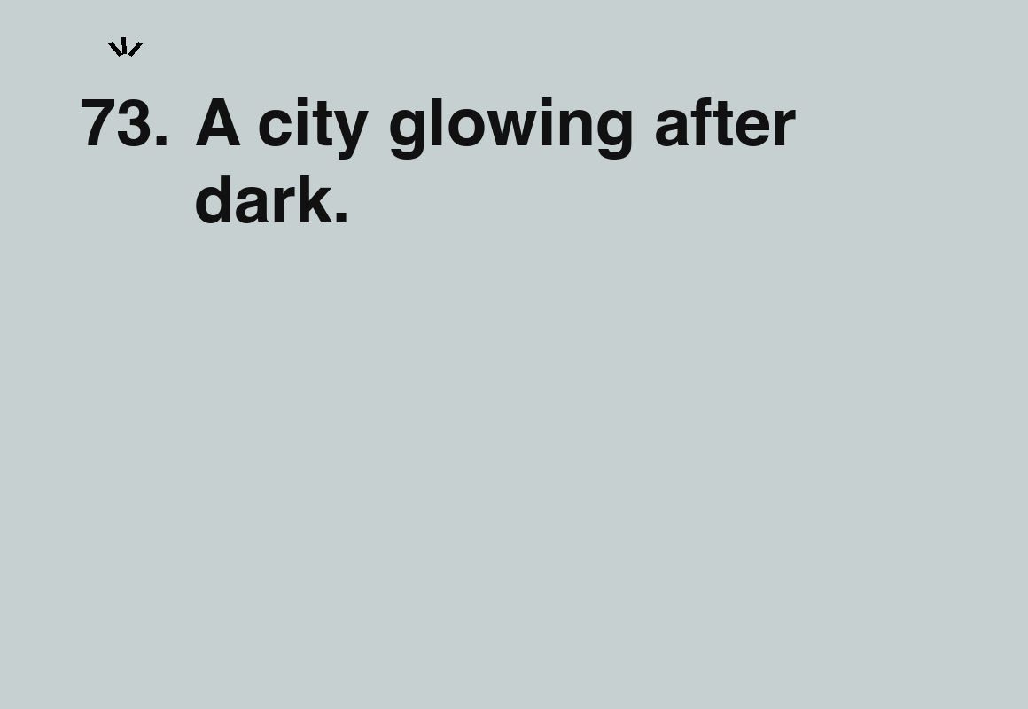 A city glowing after dark. — card 73 of the 1000 little things list