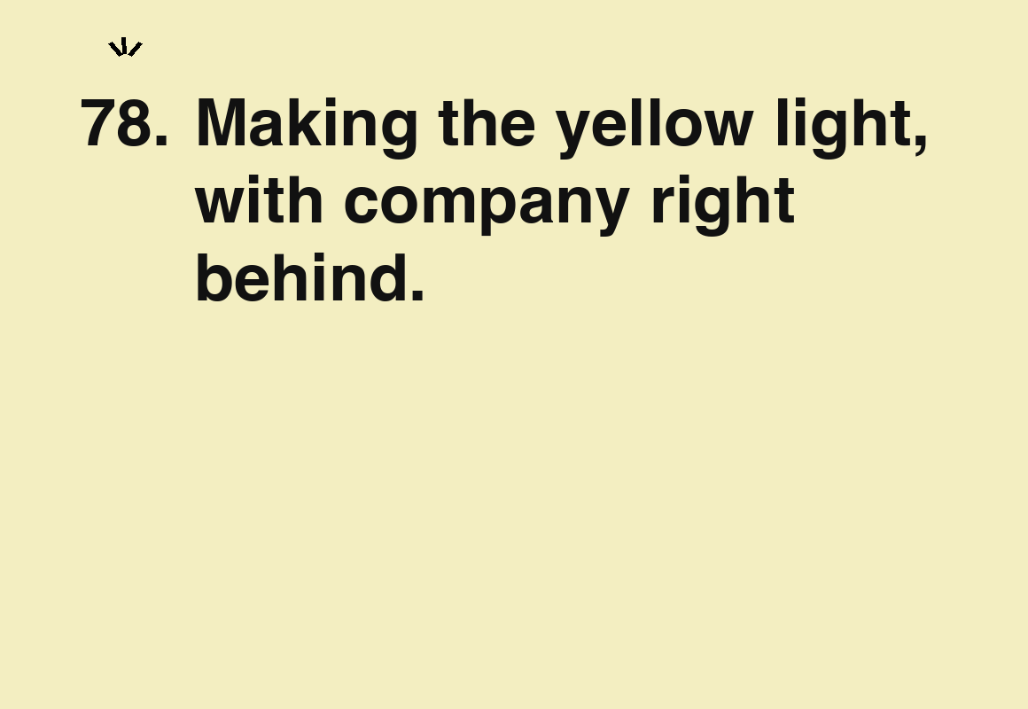 Making the yellow light, with company right behind. — card 78 of the 1000 little things list